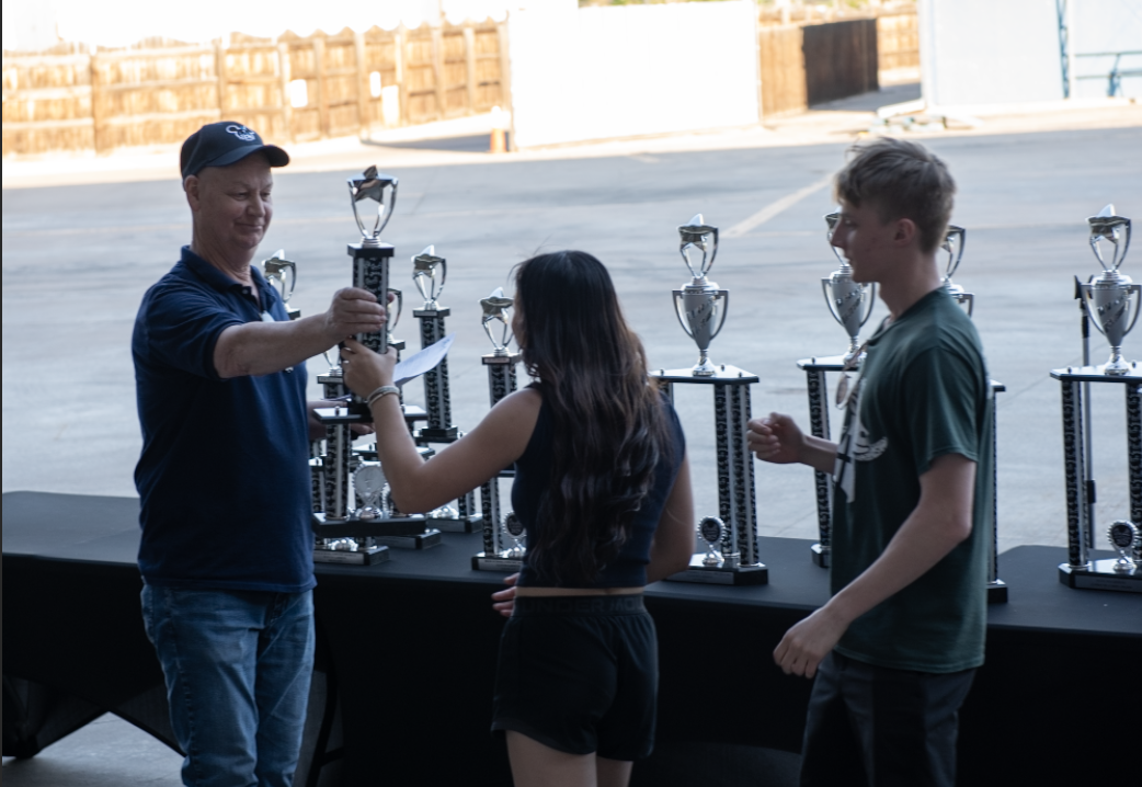 5.10.25 Seniors Nhinhi Grace and Owen Horn-Charnesky receive the 1st place award for class A orchestra. 